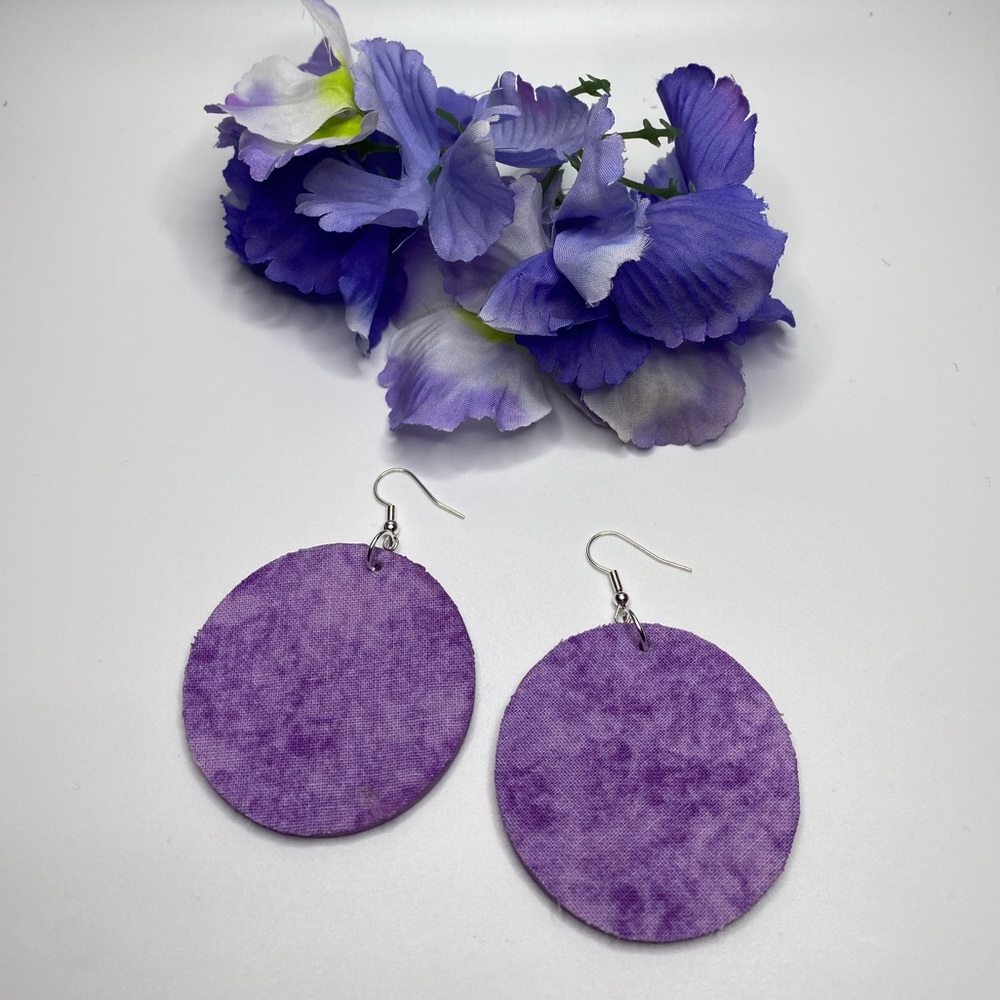 Purple handcrafted fabric over wood and painted.